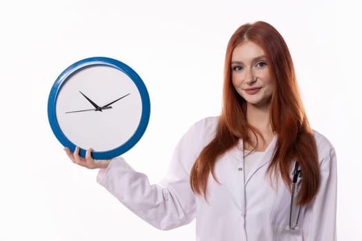 A doctor holding a clock symbolizes the crucial importance of effective time management in healthcare practices