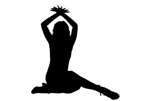A striking silhouette of a woman sitting gracefully on the floor with her hands raised high in the air, creating a dynamic visual effect