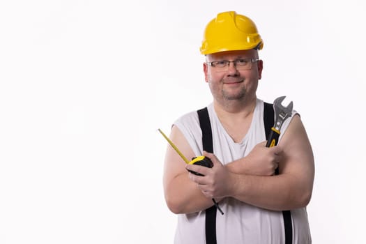 A skilled handyman shows off his tools, demonstrating his readiness for repairs and maintenance work
