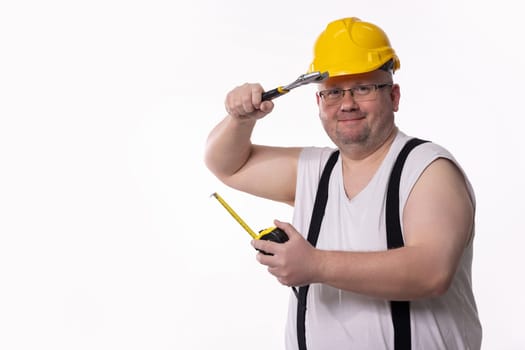 A comical construction worker is humorously posing with various tools, showcasing a lighthearted view on building work