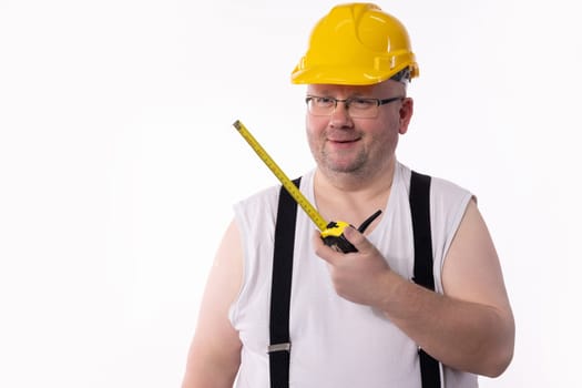 A hardworking construction worker in a bright hard hat holds a measuring tape, embodying the DIY spirit