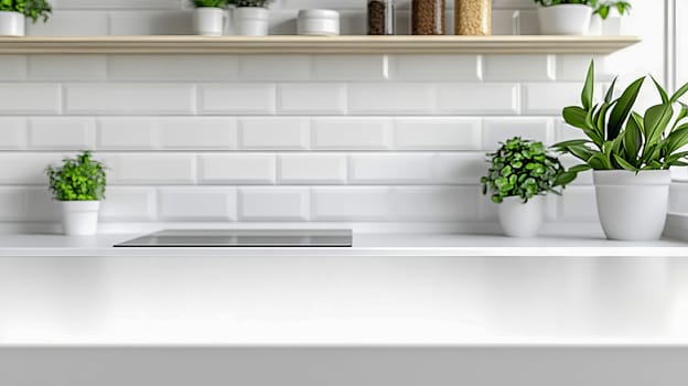 Blurred interior of stylish modern kitchen with massive straight white table for display of products or set of goods.