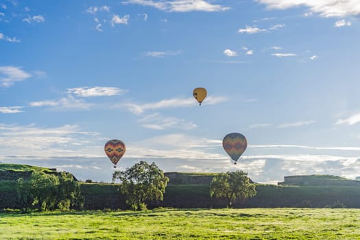 An aerial view of hot air balloons above the Teotihuacan pyramid. Adventure travel, cultural heritage, and aerial exploration concept.