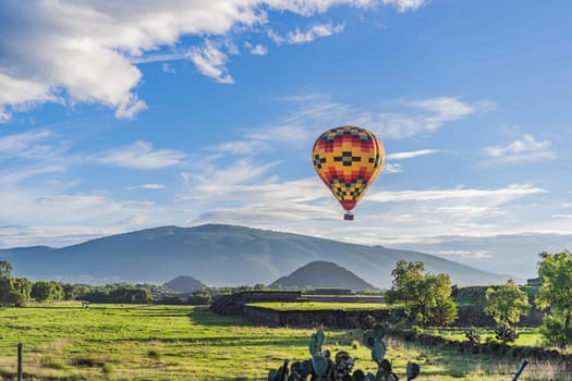 An aerial view of hot air balloons above the Teotihuacan pyramid. Adventure travel, cultural heritage, and aerial exploration concept.