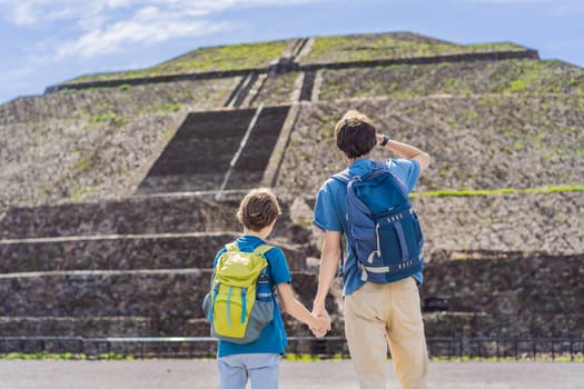Father and son tourists exploring Teotihuacan, Mexico. Cultural heritage, ancient ruins, and archaeological adventure concept.