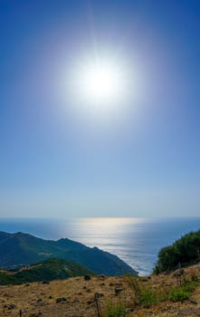 View of the Mediterranean Sea with the sun backlit. Sardinia, Italy