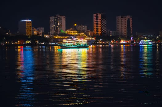 Night panorama of the Han River embankment and skyscrapers in the center of Da Nang in Vietnam at night