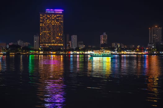 Night panorama of Han River embankment and skyscrapers in Da Nang in Vietnam at night