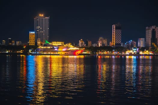 Night panorama of Han River embankment and skyscrapers in Da Nang in Vietnam at night