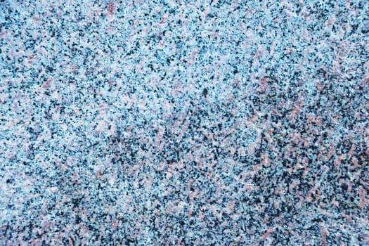Surface of blue granite slab. Stone floor close-up.