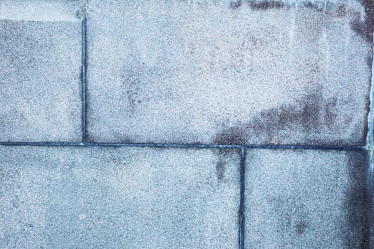 Fragment of an old abandoned wall, brick and tile. Blue wall.