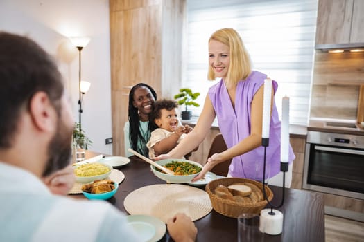 A joyful family meal takes place, filled with laughter and love.