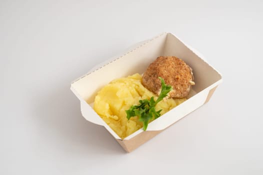 Takeout meals served in biodegradable containers, mashed potatoes with meatball