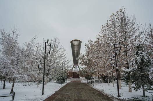 SHYMKENT, KAZAKHSTAN - DECEMBER 09, 2023: Monument Altyn Shanyrak in Independence Park in Shymkent city in Southern Kazakhstan in winter with snow