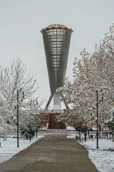 SHYMKENT, KAZAKHSTAN - DECEMBER 09, 2023: Monument Altyn Shanyrak in Independence Park in Shymkent city in Southern Kazakhstan in winter with snow