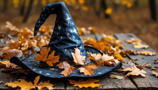 A whimsical witch's hat rests among colorful autumn leaves and tiny pumpkins on a weathered wooden surface, evoking the magic and warmth of fall festivities.