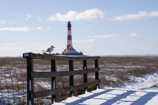 Panoramic image of Westerhever lighthouse during wintertime, North Frisia, Germany 