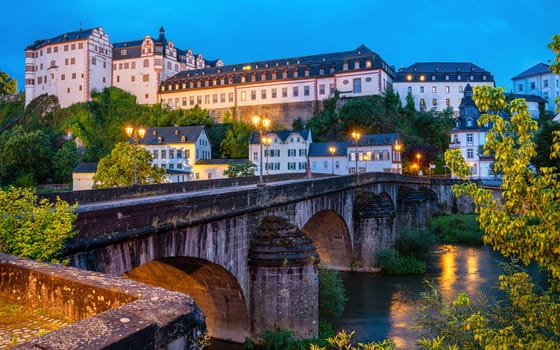 WEILBURG; GERMANY - AUGUST 3; 2023: Panoramic image of historic buildings of Weilburg close to the Lahn river on August 3; 2023 in Hesse; Germany