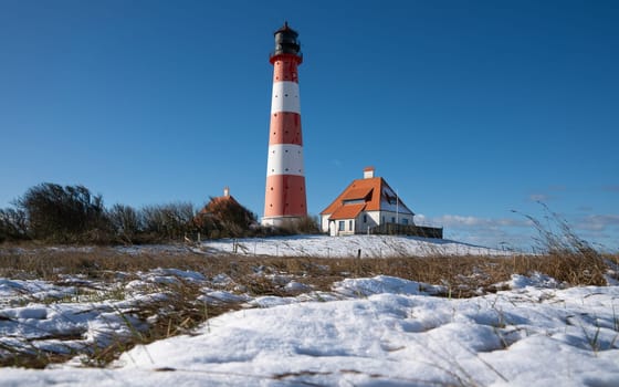 Panoramic image of Westerhever lighthouse during wintertime, North Frisia, Germany 