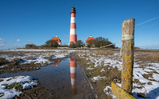 Panoramic image of Westerhever lighthouse during wintertime, North Frisia, Germany 