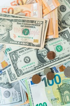 Multicurrency banknotes, coins. The concept of the world economy during the crisis. Money rules in world events, the stock exchange and the trade link between countries