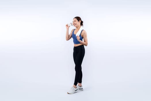 Full body asian woman in sportswear portrait, smiling and posing cheerful gesture. Workout training with attractive girl engage in her pursuit of healthy lifestyle. Isolated background Vigorous