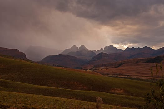 A stormy sunset at Cathedral Peak in the Drakensberg Mountains. KwaZulu-Natal Province, South Africa