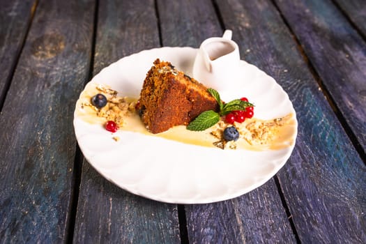 lean carrot sponge cake on a plate in a restaurant.