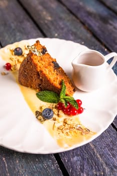 lean carrot sponge cake on a plate in a restaurant.