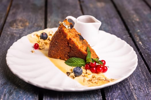 a piece of sponge cake on a plate. dessert in the restaurant photo for the menu.