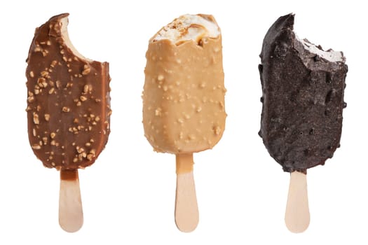 Chocolate ice cream on a stick isolated on a white background. Three portions of bitten ice cream in chocolate glaze of different sizes and different colors for insertion into the project.