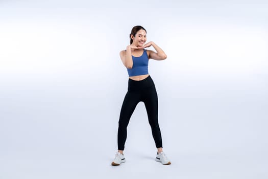 Full body asian woman in sportswear portrait, smiling and posing cheerful gesture. Workout training with attractive girl engage in her pursuit of healthy lifestyle. Isolated background Vigorous