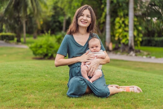 A happy 40-year-old mother cradles her newborn in a sun-drenched park. Love, family and generations in harmony.