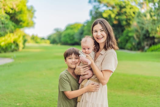 A happy 40-year-old mother cradles her newborn with her adult son in a sun-drenched park. Love, family and generations in harmony.