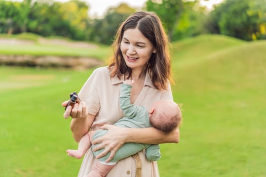 Loving mother gently applies soothing aroma oils to her precious newborn, creating a calming and nurturing atmosphere.