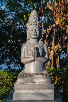 Buddhist statue of a female deity in park at pagoda at the Cham Towers in Nha Trang in Vietnam