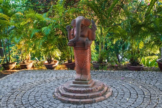 statue of the Buddhist god Ganesha elephant on a pagoda in Vietnam in Asia
