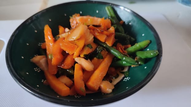 vegetables and fish, healthy food in a green plate. High quality photo