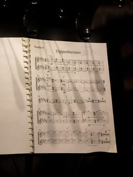 Music sheets. Melodies written with different musical symbols as background, closeup. High quality photo