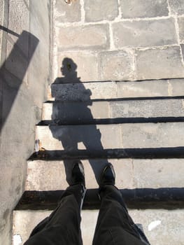 shadow of a man on marble stone steps 18 August 2024 Tbilisi Georgia. High quality photo