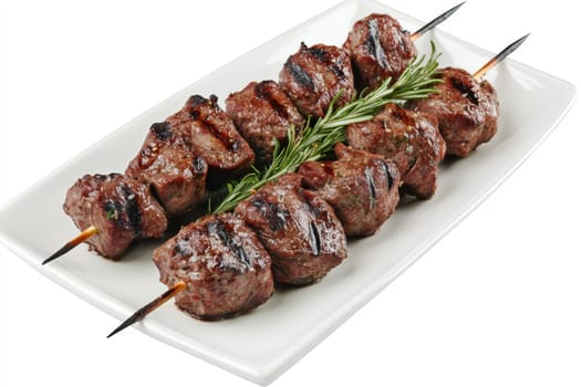 Juicy shashlik on a white plate. Side view. High quality photo