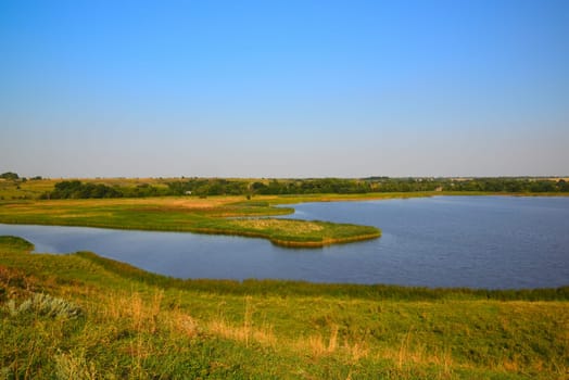 Autumn landscape with pond in Russia