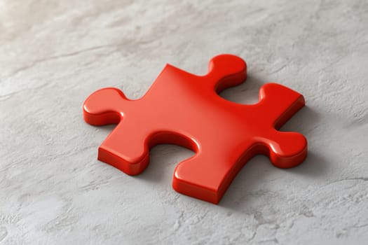 Single red jigsaw puzzle piece resting on a gray surface, representing problem-solving, strategy, and connection