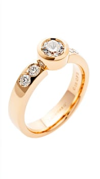 Simple gold engagement ring with a large diamond is sparkling on a white background. The ring is simple but elegant, perfect for a proposal