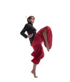 Woman wearing traditional chinese red and black clothes practicing wushu isolated full-length shot on white background