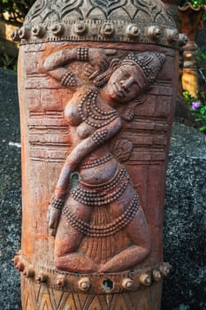 sculpture statue of a female deity on a Buddhist pagoda in Asia in Vietnam