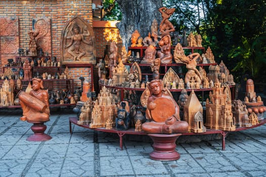 Buddhist religious clay figurines and pottery in souvenir shop on the Po Nagar Cham Towers in Nha Trang, Vietnam