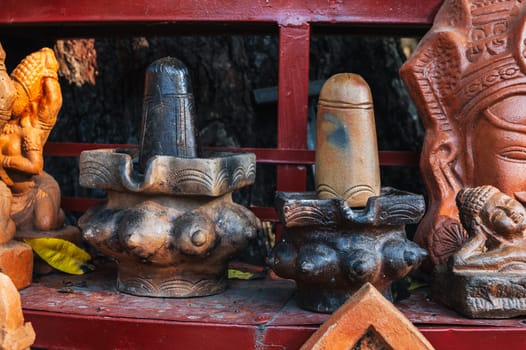 Clay figurines and statues of lingam in a souvenir shop in Vietnam in Asia