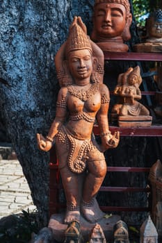 Clay Buddhist figurine statue of a female deity in a souvenir shop in Vietnam in Asia