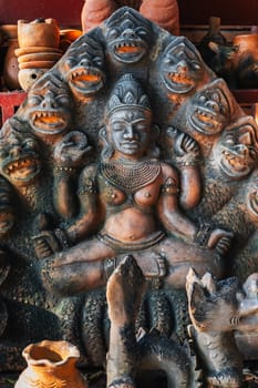 Clay Buddhist figurine statue of the god Shiva in a souvenir shop in Vietnam in Asia